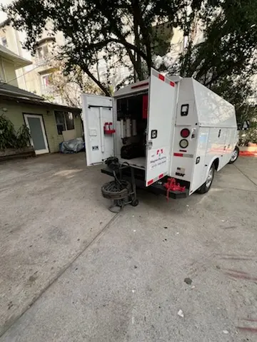 Magnet Plumbing service vehicle on-site for Grease Trap Cleaning in Bat Cave